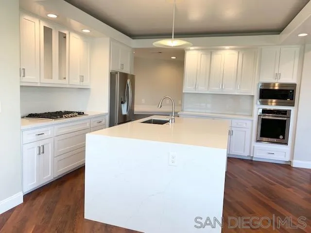 827 Mountain View Road El Cajon, CA 92021 - Photo 4 of 58 a kitchen with a stove a sink and a refrigerator