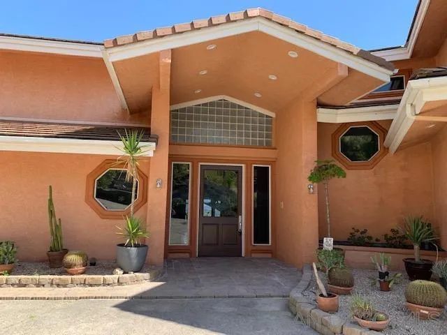 827 Mountain View Road El Cajon, CA 92021 - Photo 42 of 58 a front view of a house with garden