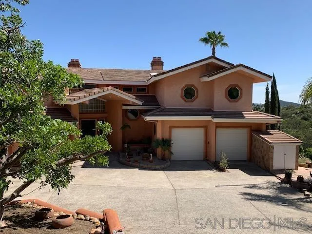 827 Mountain View Road El Cajon, CA 92021 - Photo 43 of 58 a front view of a house with a yard