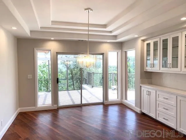 827 Mountain View Road El Cajon, CA 92021 - Photo 9 of 58 a view of an empty room with wooden floor and a window