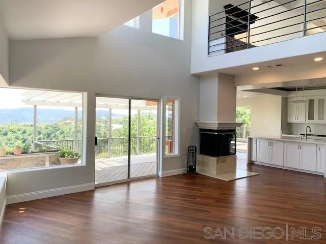827 Mountain View Road El Cajon, CA 92021 - Photo 10 of 58 a view of a living room and kitchen with a large window