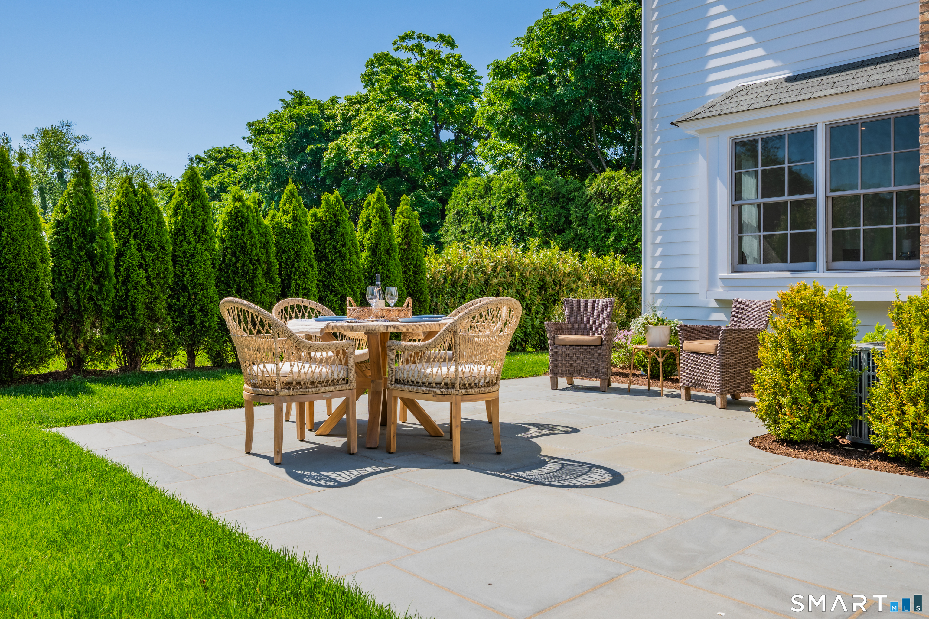 920 Old Post Road Fairfield, CT 06824 - Photo 33 of 40 Bluestone patio, very private will tall shrubbery and lawn area