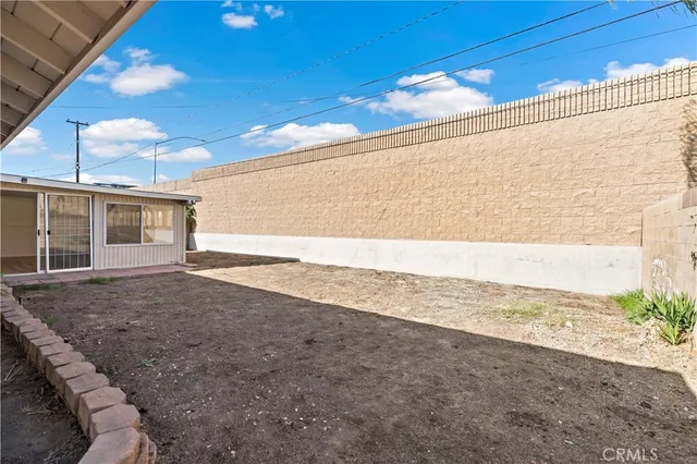 a view of a backyard of the house