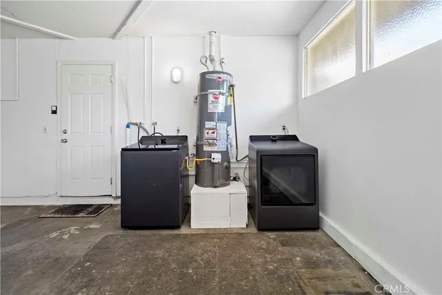 a view of a storage & utility room with washer and dryer