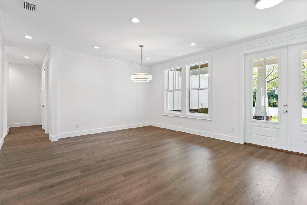 100 Grizzly Street Freeport, FL 32439 - Photo 19 of 65 an empty room with wooden floor and windows