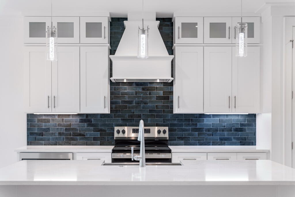 100 Grizzly Street Freeport, FL 32439 - Photo 2 of 65 a kitchen with granite countertop a sink and a stove