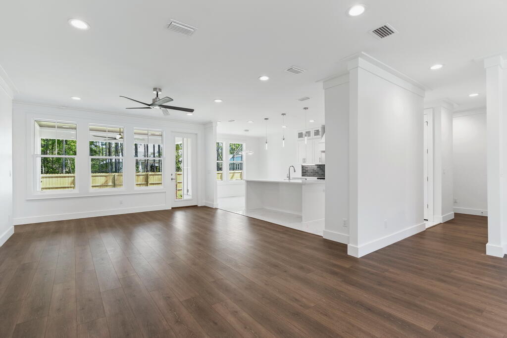 100 Grizzly Street Freeport, FL 32439 - Photo 22 of 65 a view of wooden floor and windows in a room