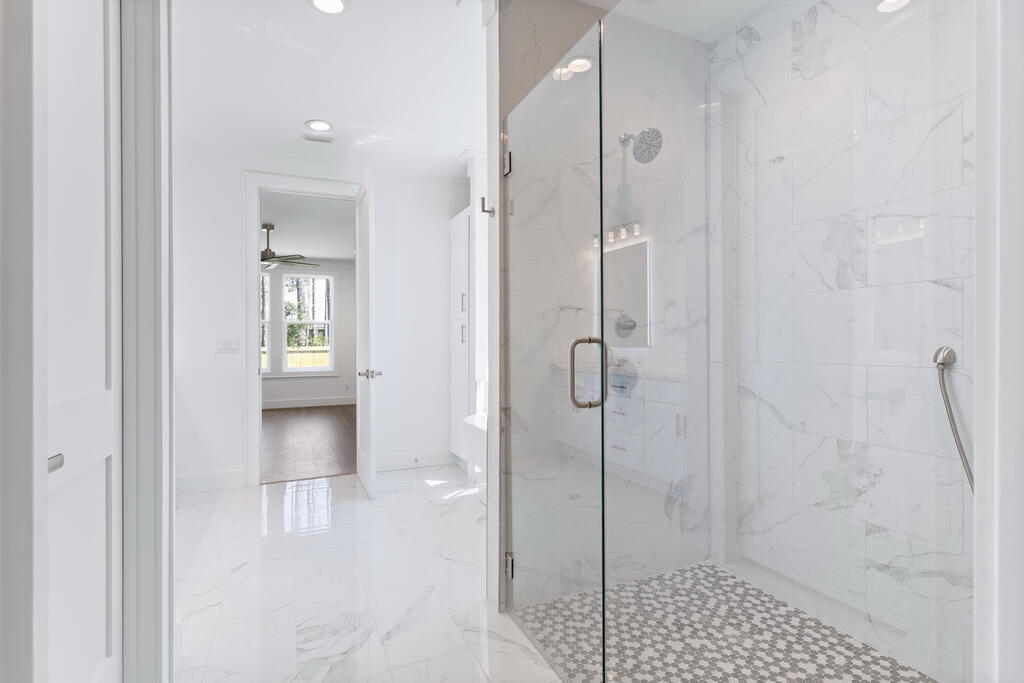 100 Grizzly Street Freeport, FL 32439 - Photo 32 of 65 a bathroom with a shower and a sink