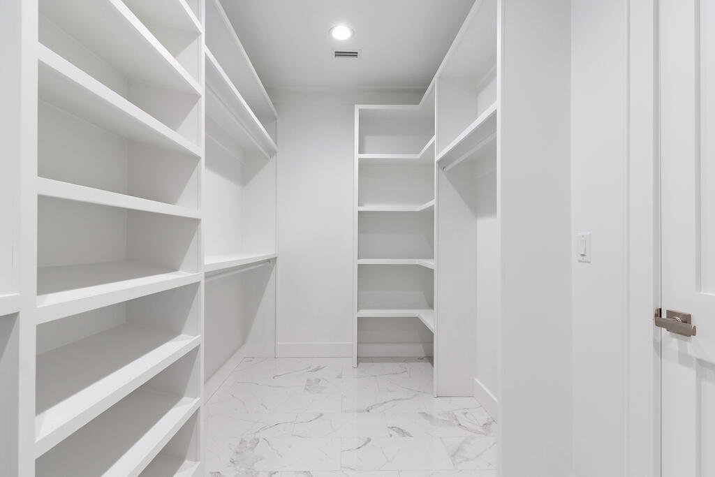 100 Grizzly Street Freeport, FL 32439 - Photo 33 of 65 a view of walk in closet with empty racks