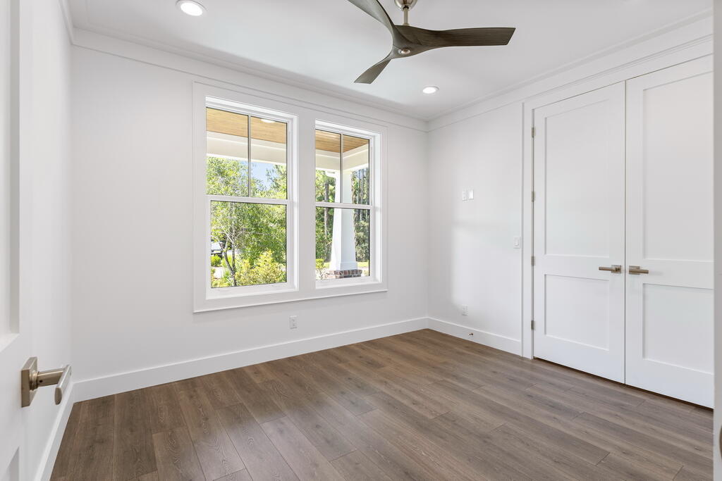 100 Grizzly Street Freeport, FL 32439 - Photo 35 of 65 a view of an empty room with wooden floor and a window