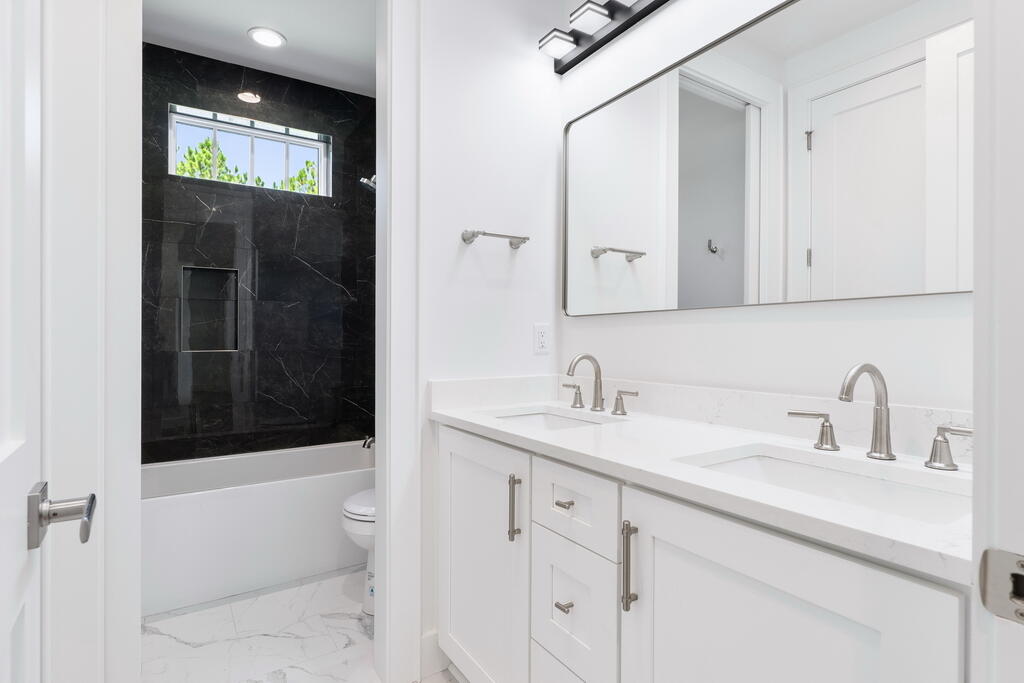 100 Grizzly Street Freeport, FL 32439 - Photo 41 of 65 a bathroom with a sink a toilet and shower