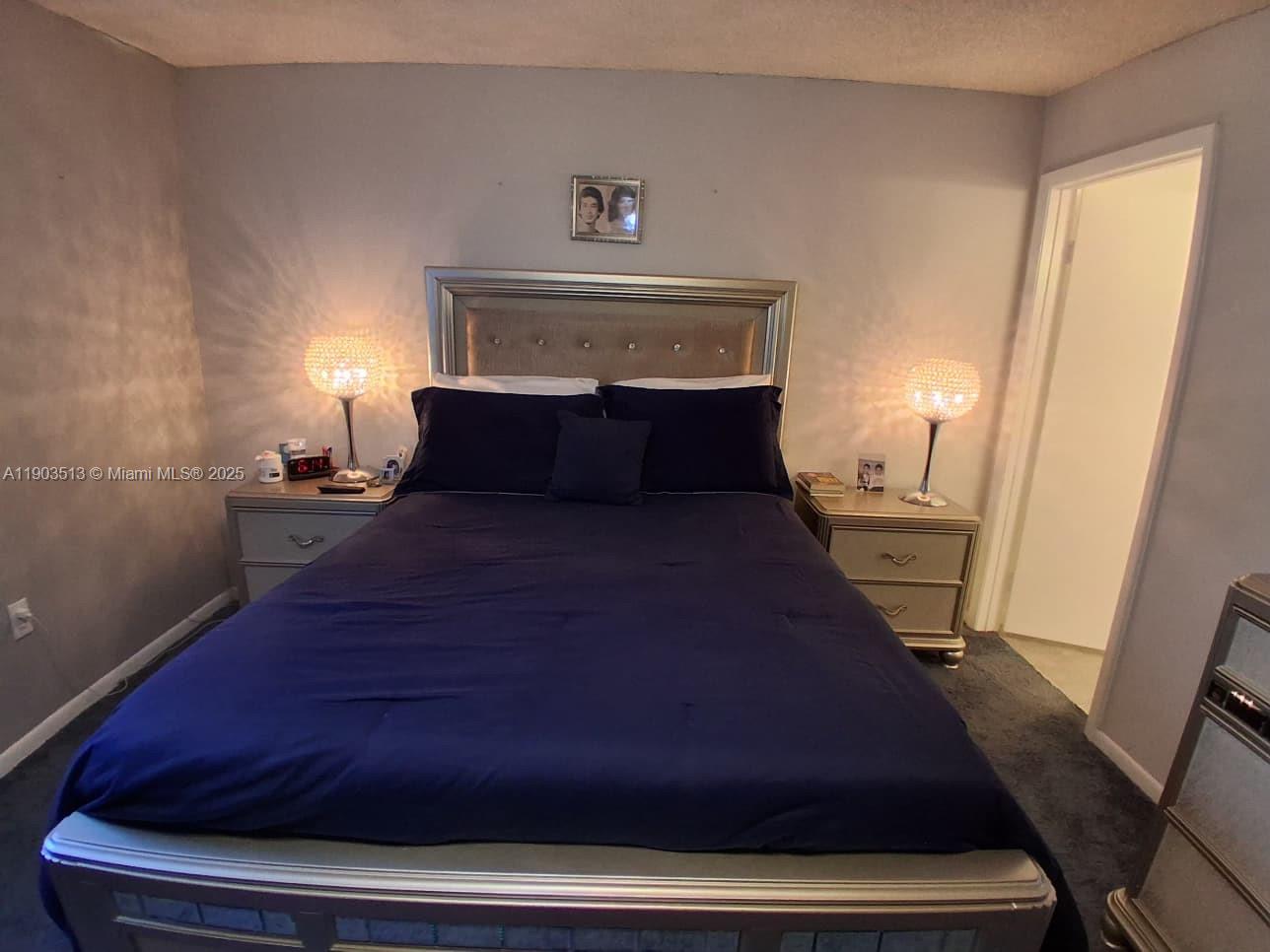 10830 Northwest 8th Street Pembroke Pines, FL 33026 - Photo 27 of 69 a bedroom with a bed and a window