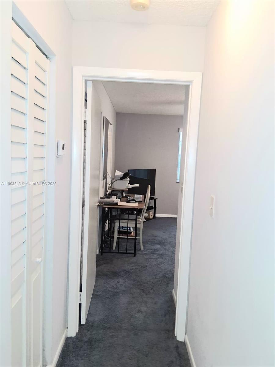 10830 Northwest 8th Street Pembroke Pines, FL 33026 - Photo 29 of 69 a view of a hallway with seating area