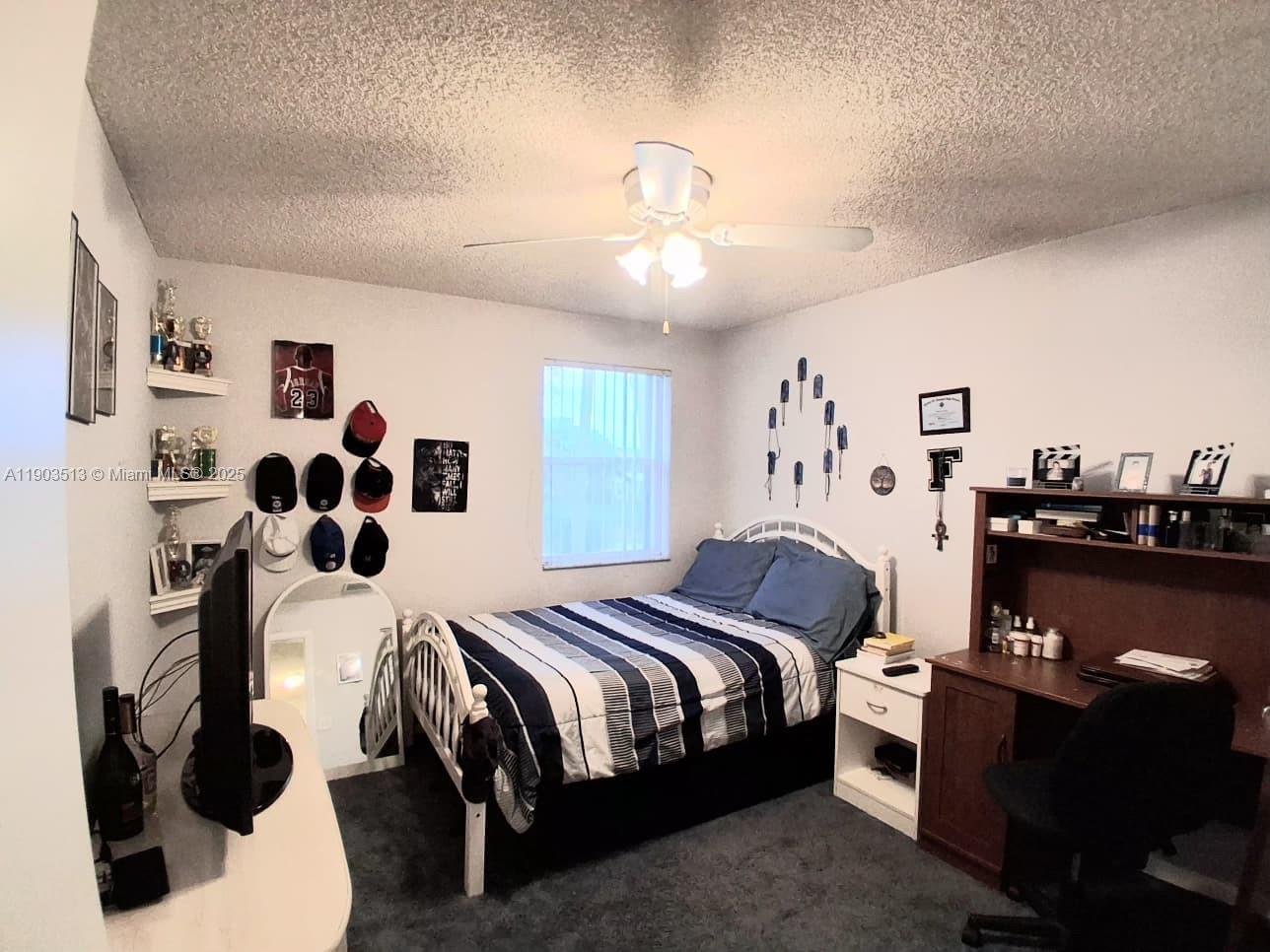 10830 Northwest 8th Street Pembroke Pines, FL 33026 - Photo 36 of 69 a bedroom with a bed and a mirror