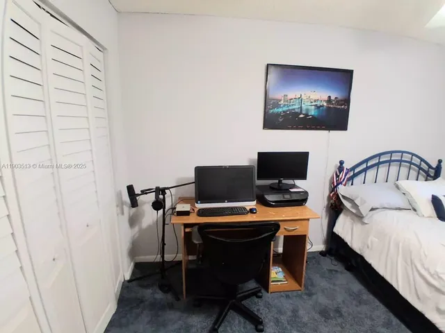 a view of a chairs and table in patio