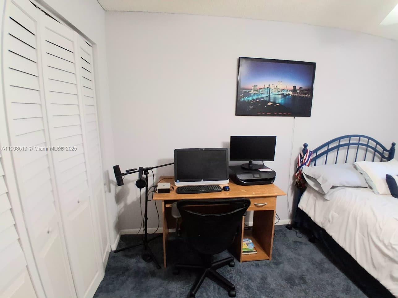 10830 Northwest 8th Street Pembroke Pines, FL 33026 - Photo 37 of 69 a bedroom with a bed and a flat screen tv