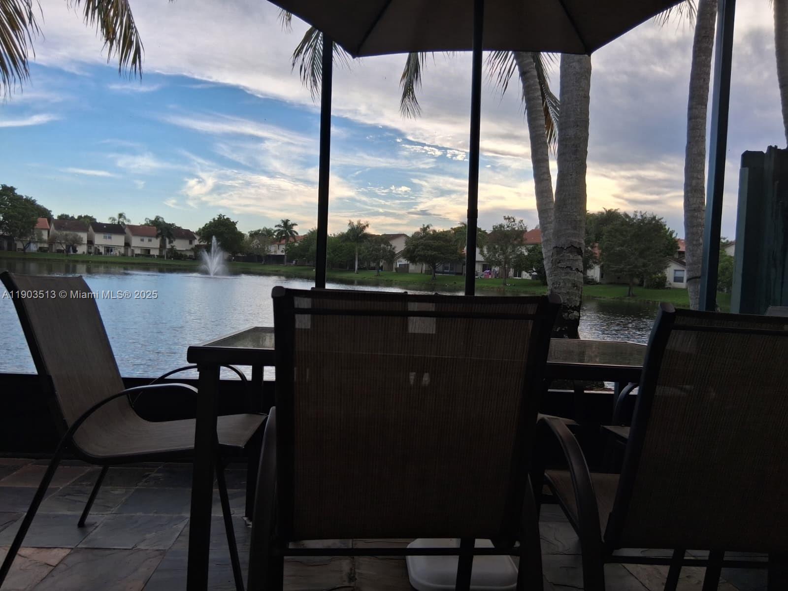 10830 Northwest 8th Street Pembroke Pines, FL 33026 - Photo 46 of 69 a view of a chairs and table in patio