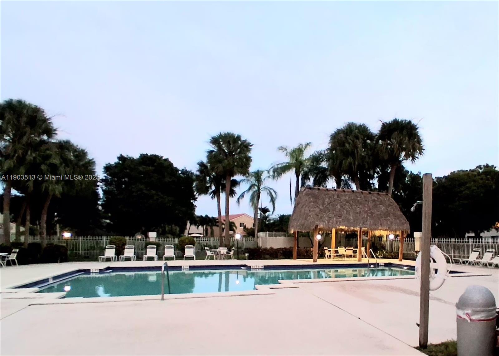 10830 Northwest 8th Street Pembroke Pines, FL 33026 - Photo 65 of 69 a front view of house with yard and green space