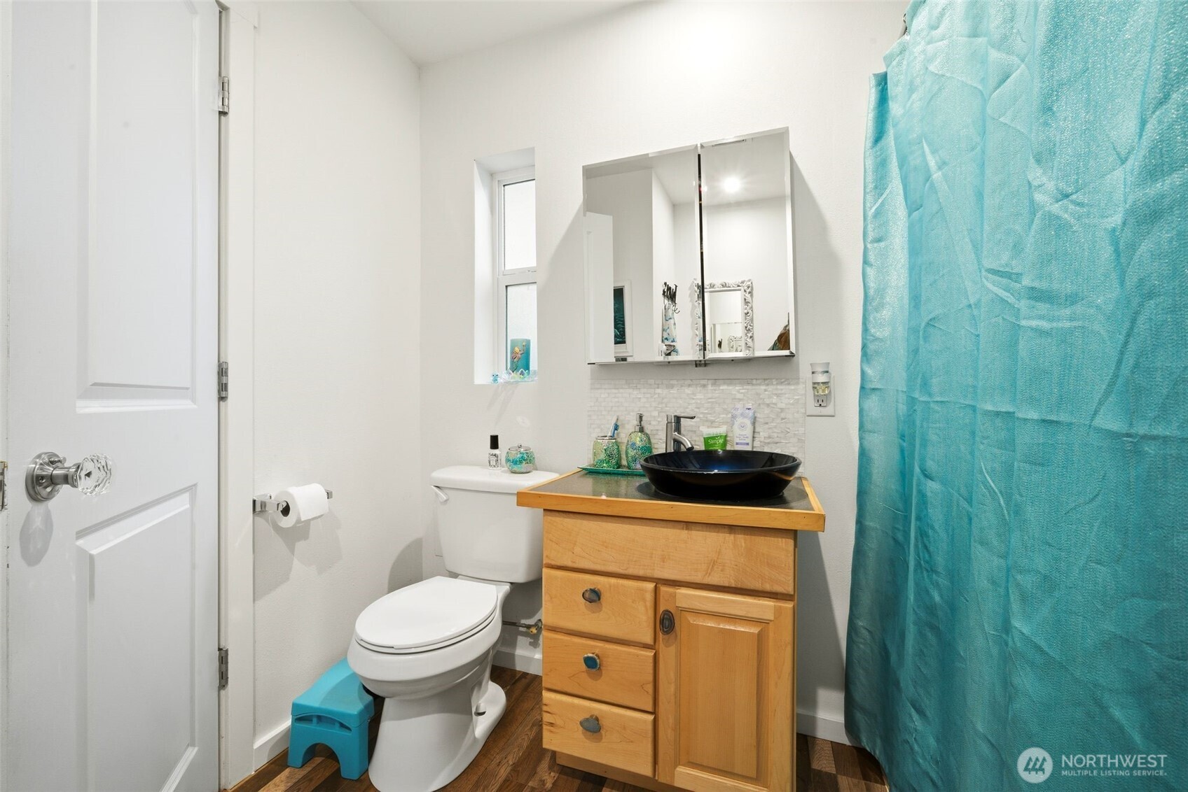 0 Jennings Street Sedro-Woolley, WA 98284 - Photo 16 of 40 a white toilet sitting next to a bathroom sink and vanity