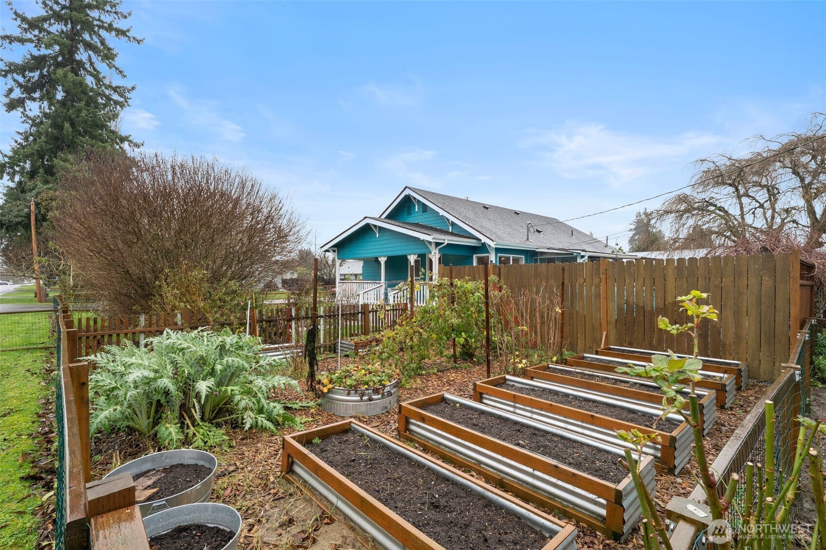 0 Jennings Street Sedro-Woolley, WA 98284 - Photo 24 of 40 a view of backyard with table and chairs and potted plants