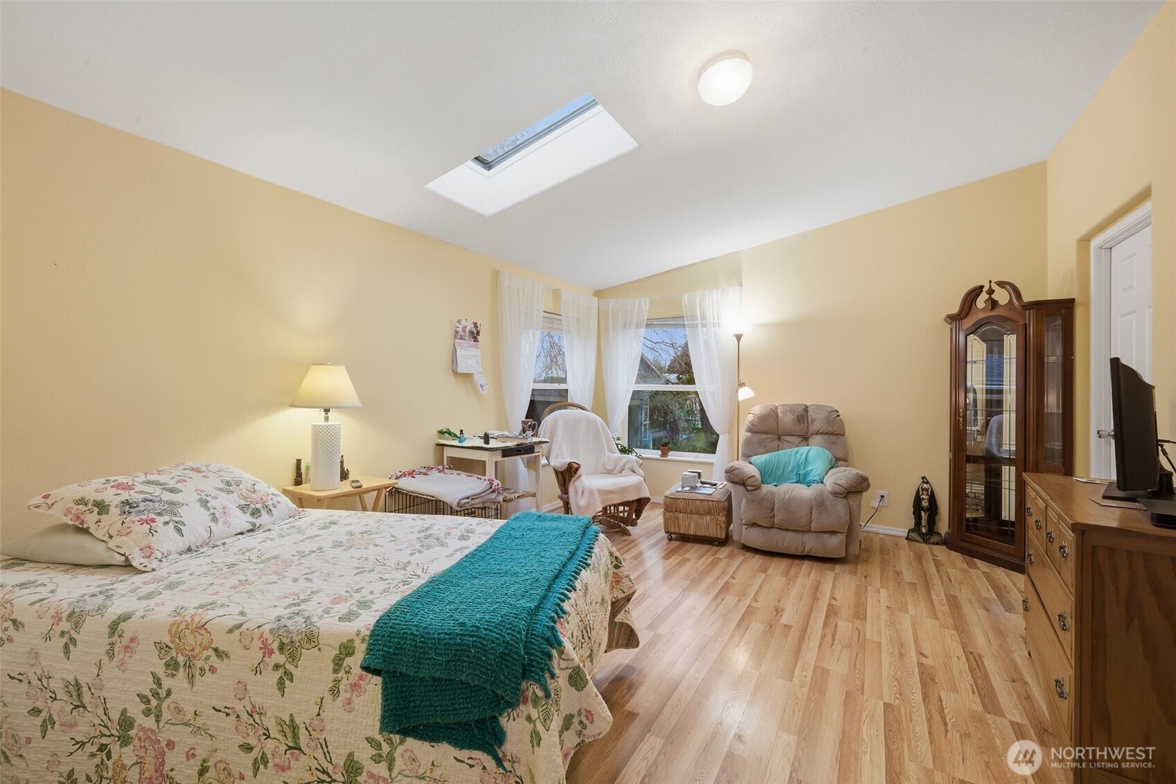 0 Jennings Street Sedro-Woolley, WA 98284 - Photo 29 of 40 a bedroom with furniture and a wooden floor