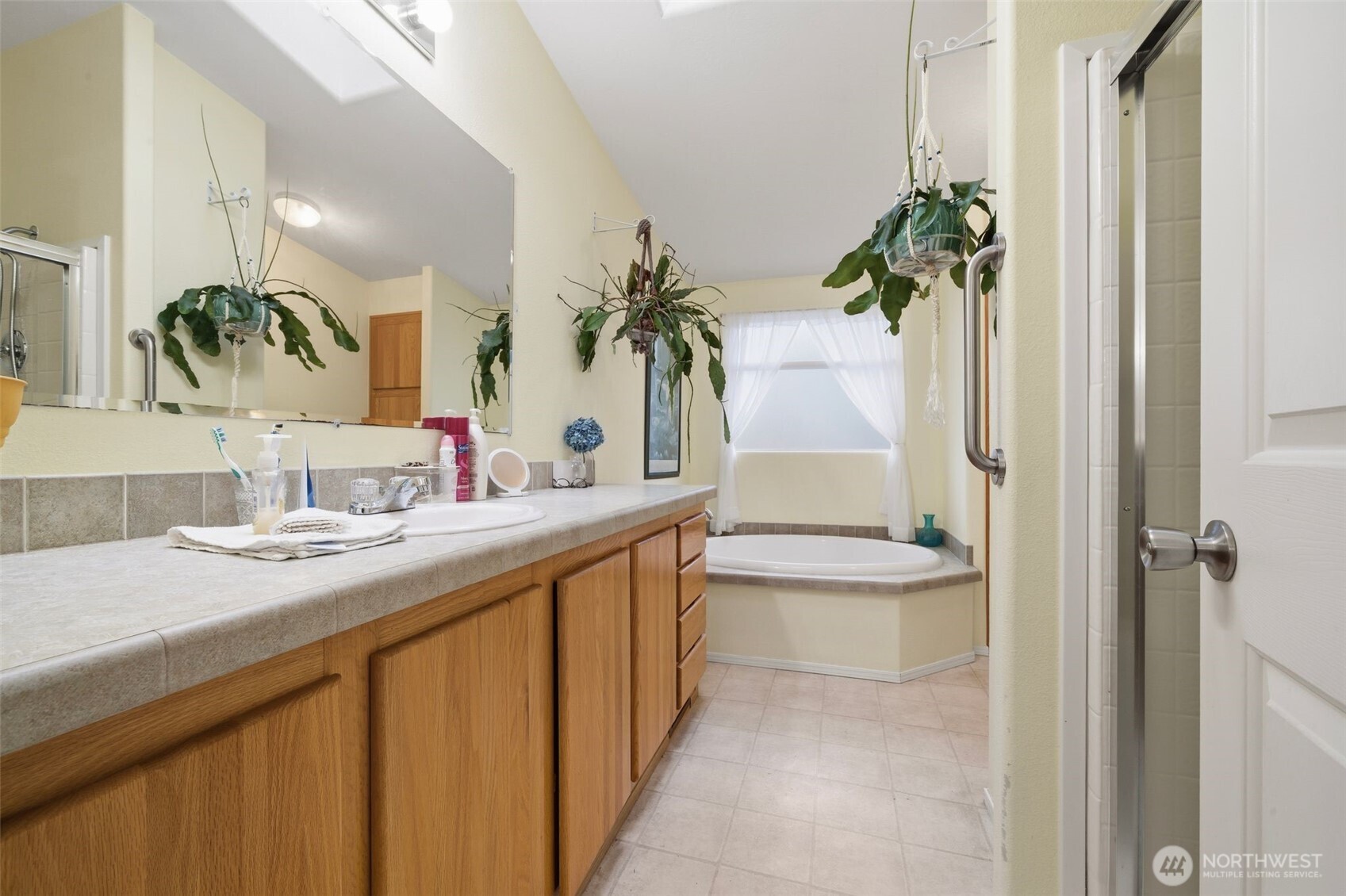0 Jennings Street Sedro-Woolley, WA 98284 - Photo 31 of 40 a bathroom with a granite countertop sink a toilet and a mirror