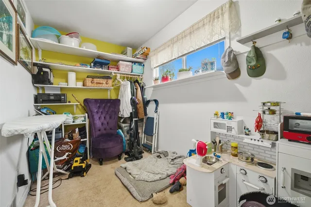 a utility room with dryer washer and other items