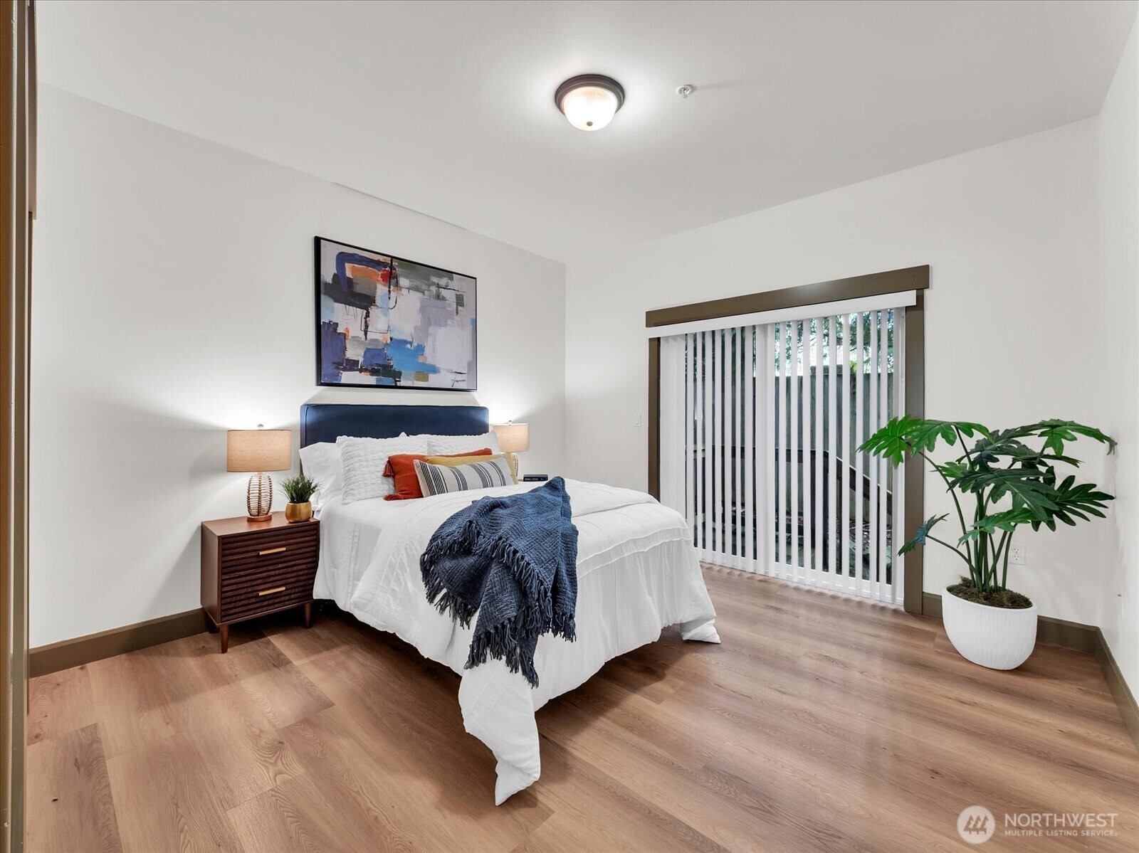 2115 201st Place Southeast, Unit K2 Bothell, WA 98012 - Photo 11 of 28 a bed room with a bed and a painting