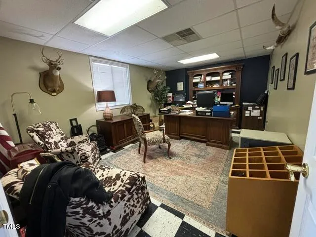 a living room with lots of furniture and a rug