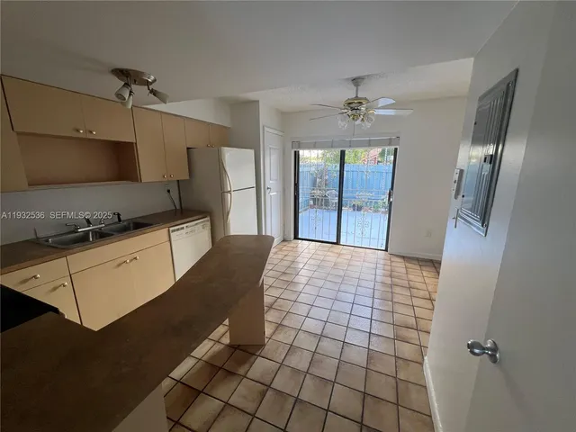 a view of a kitchen with a stove cabinets and wooden floor