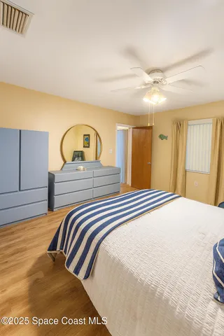 a living room with furniture a table and a large window