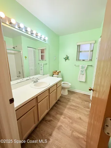 a view of a lake with houses in background