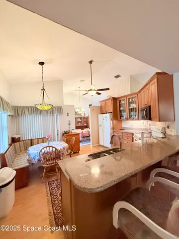 a living room with furniture a table and a fireplace