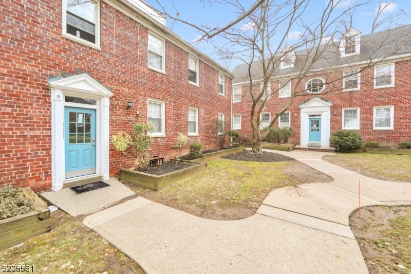 495 Main Street, Unit B 2 Chatham, NJ 07928 - Photo 1 of 22 a view of a building with many windows