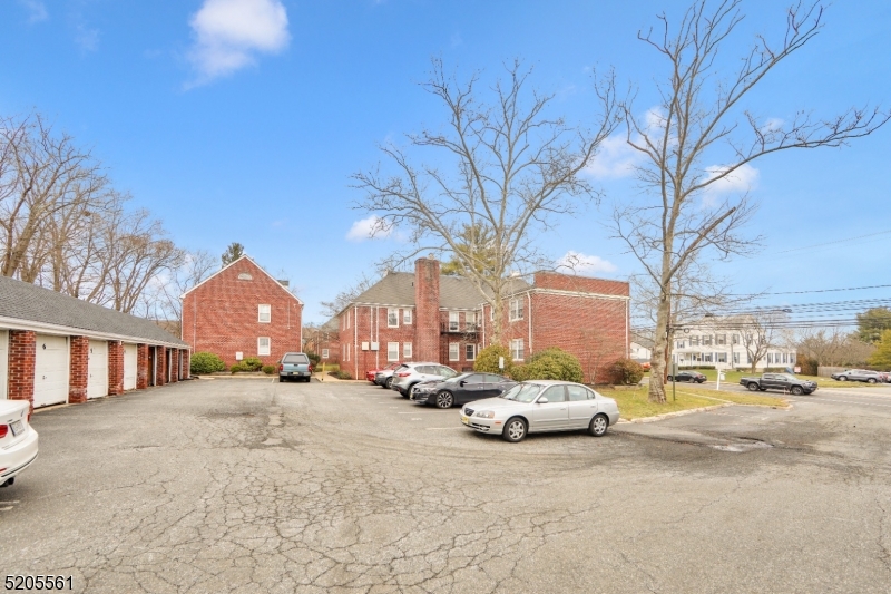 495 Main Street, Unit B 2 Chatham, NJ 07928 - Photo 14 of 22 a view of city street with a parked cars side of road and a building