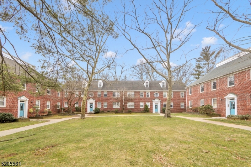 495 Main Street, Unit B 2 Chatham, NJ 07928 - Photo 15 of 22 a swimming pool with outdoor seating and yard