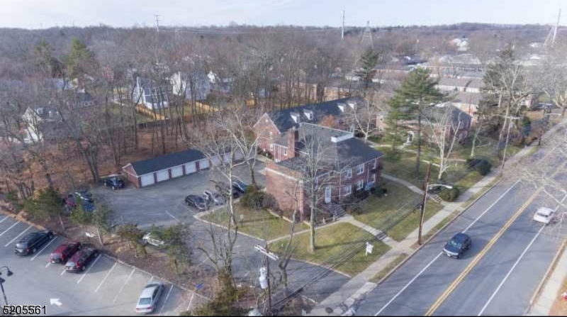 495 Main Street, Unit B 2 Chatham, NJ 07928 - Photo 17 of 22 a view of a house with a yard