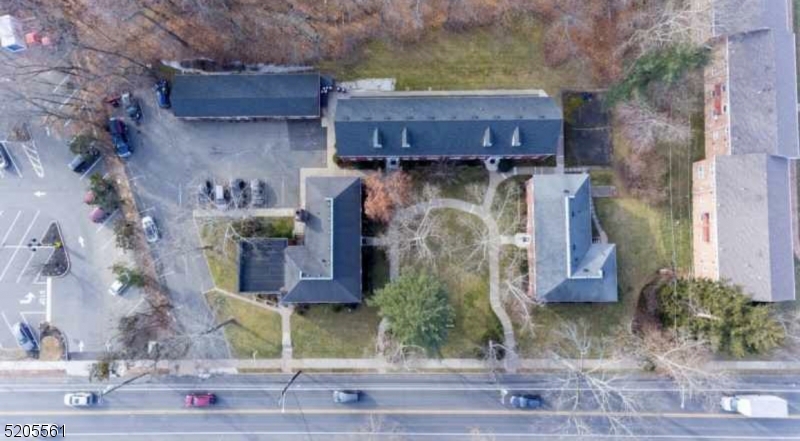 495 Main Street, Unit B 2 Chatham, NJ 07928 - Photo 18 of 22 a bed room with a wooden fence and a painting