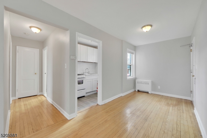 495 Main Street, Unit B 2 Chatham, NJ 07928 - Photo 4 of 22 a view of empty room with wooden floor