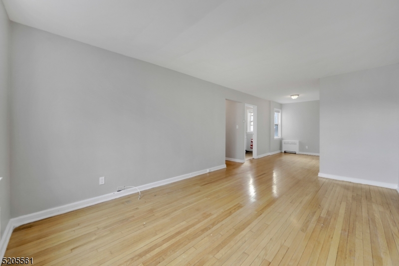 495 Main Street, Unit B 2 Chatham, NJ 07928 - Photo 5 of 22 a view of an empty room with wooden floor