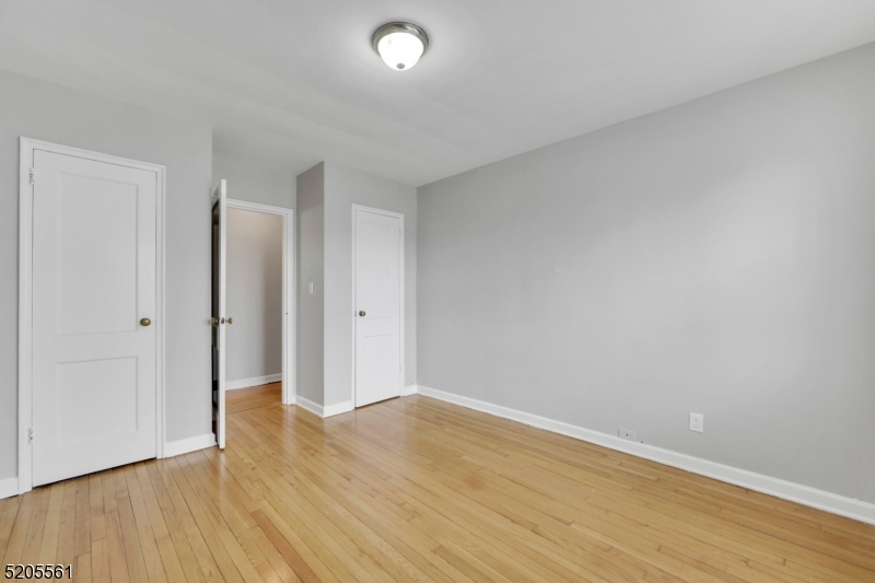 495 Main Street, Unit B 2 Chatham, NJ 07928 - Photo 8 of 22 a view of an empty room with wooden floor
