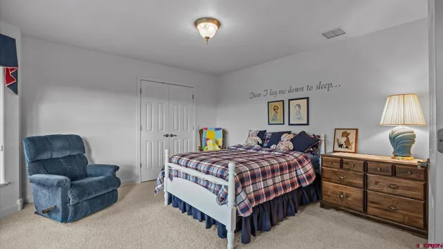 a work room with furniture and a large window