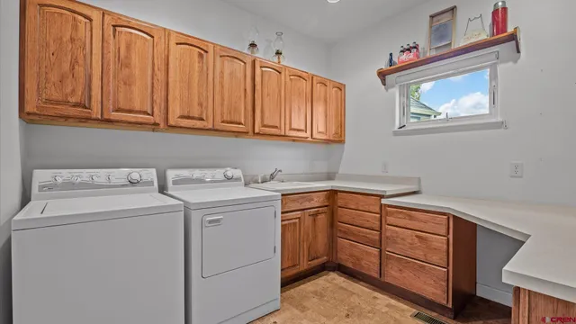 a view of an entryway with wooden floor and windows