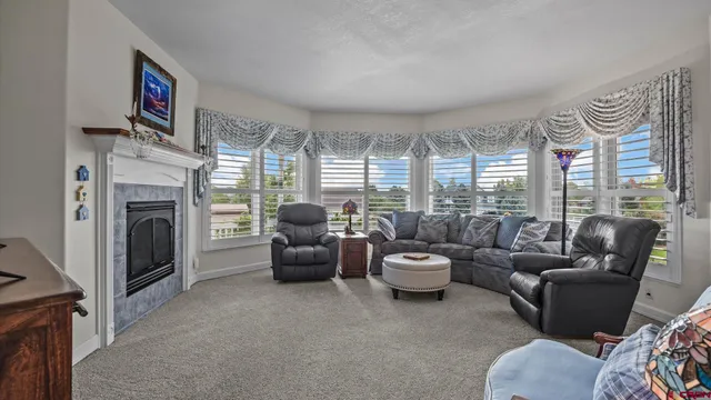 a view of a dining room with furniture window and outside view