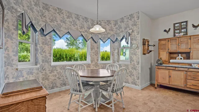 a view of a dining room with furniture