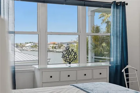 a bed room with a bed and a book shelf