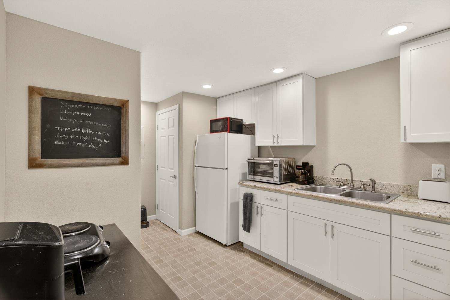 6332 Horseshoe Bar Road Loomis, CA 95650 - Photo 58 of 85 Kitchenette featuring white cabinetry with brushed nickel hardware, granite-style countertops, a double basin stainless steel sink with a high-arc faucet, and recessed ceiling lighting
