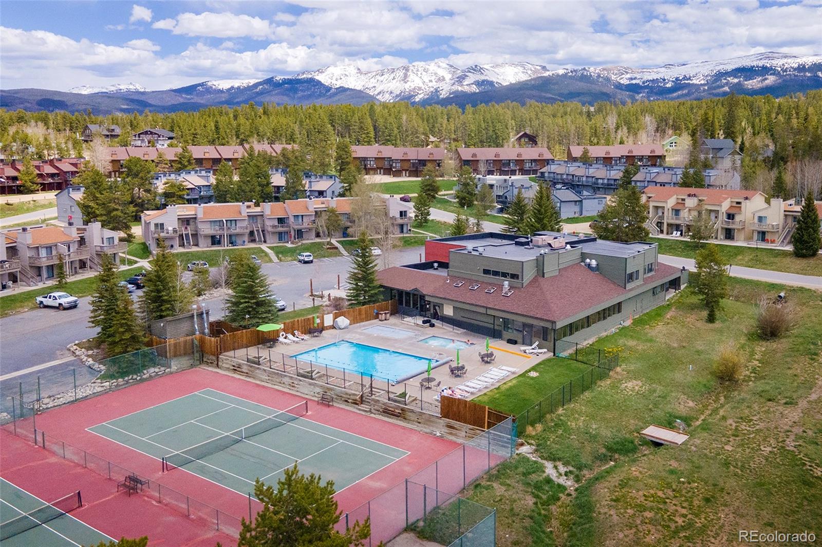 83 County Road, Unit F7 Fraser, CO 80442 - Photo 18 of 20 an aerial view of residential houses with outdoor space and swimming pool
