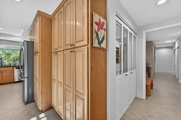 a kitchen with stainless steel appliances granite countertop a sink and a stove