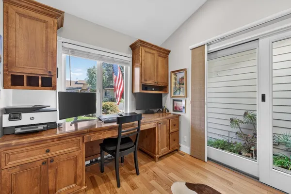 a view of living room kitchen with furniture and flat screen tv